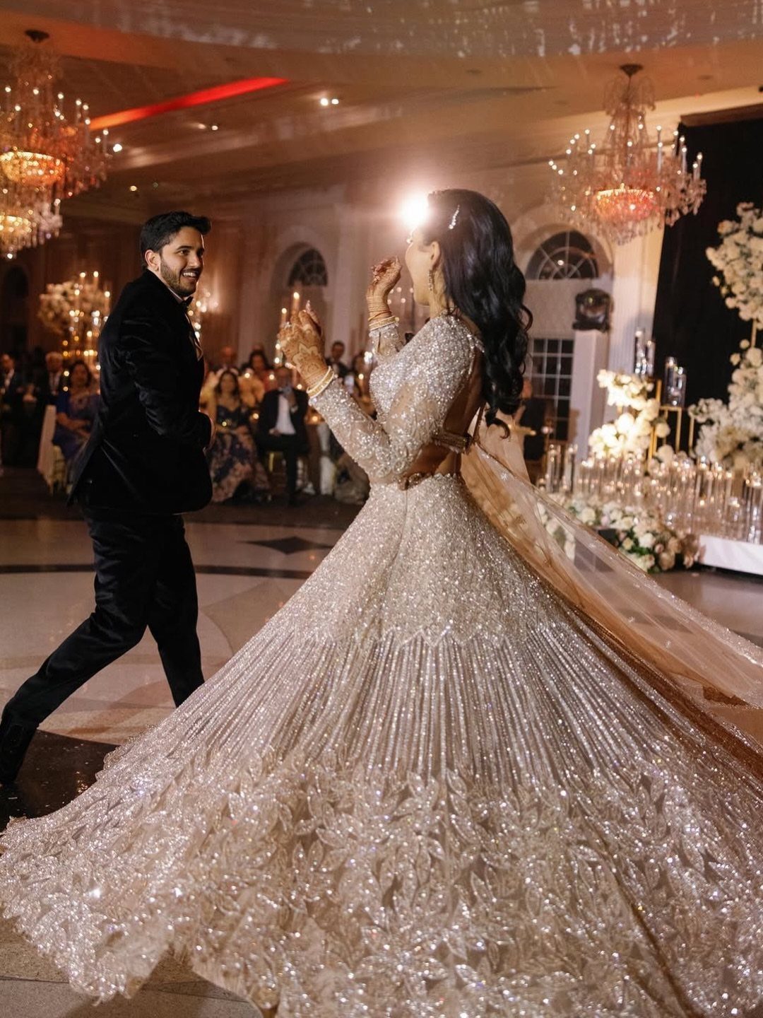 Bride Reception Dress: 17 Ideas for Your Second Look 8 Bride in a sparkling champagne gown and groom in black suit in ballroom