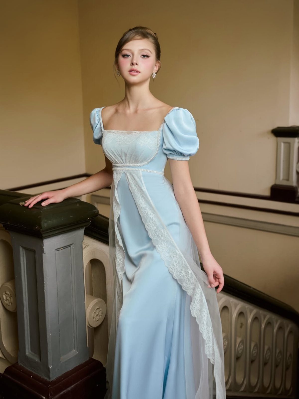 Woman in a light blue empire waist evening gown standing by a staircase.