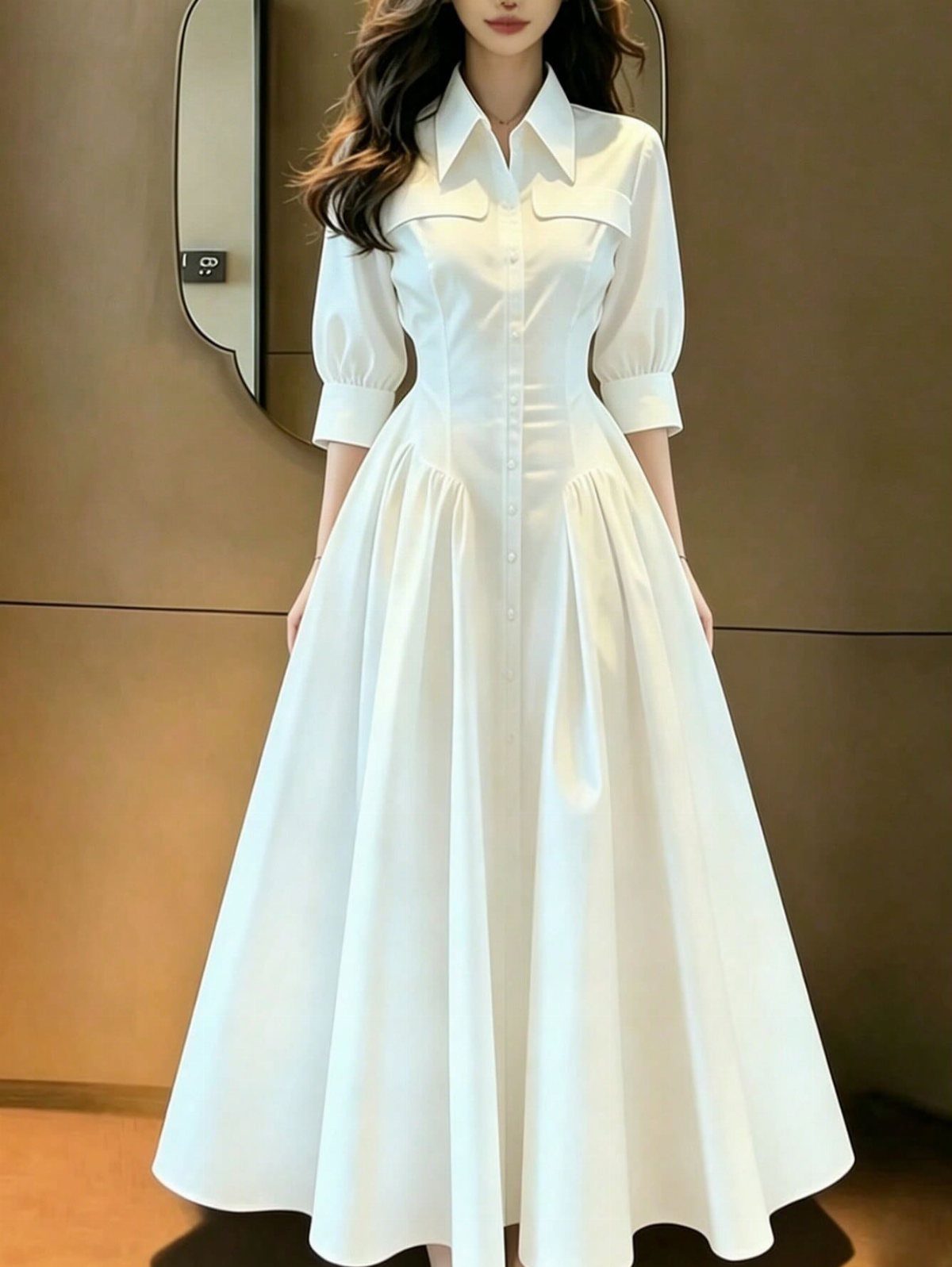 Petite Maxi Dresses in 10 Styles for Every Occasion 4 Woman in a white button-down maxi dress with puffed sleeves and a collar.