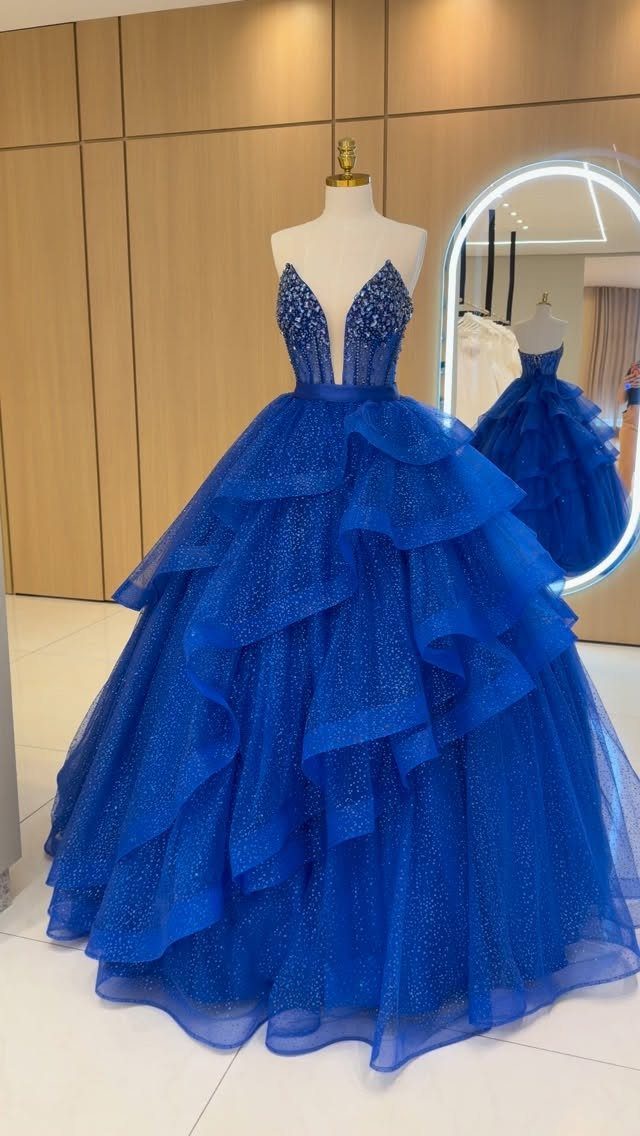 Royal Blue Colour Dress Styles: 7 Elegant Options to Try 7 Royal blue gown with a sparkling bodice and voluminous layered tulle skirt.