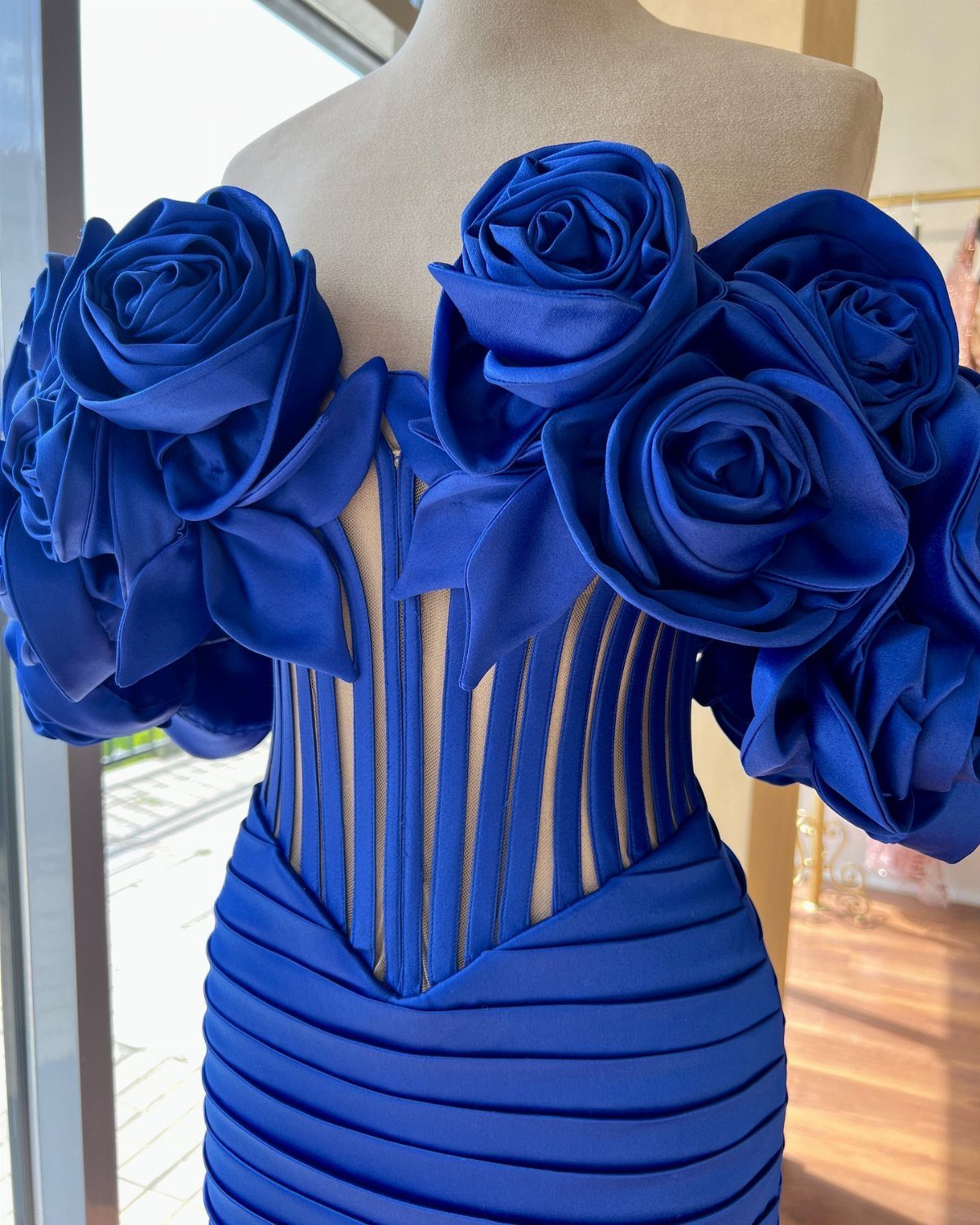 Royal Blue Colour Dress Styles: 7 Elegant Options to Try 6 Royal blue satin dress with large fabric roses on off-the-shoulder sleeves