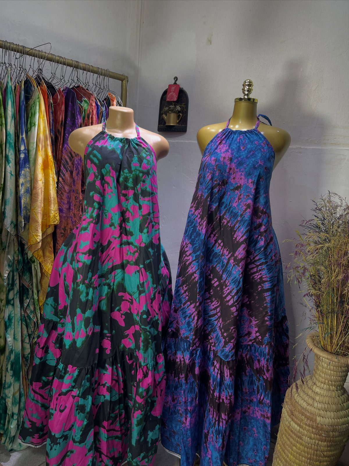 Are Summer Tank Dresses the Season's Must-Have? 8 Styles 8 Two long halter dresses on mannequins, one with a blue tie-dye pattern.