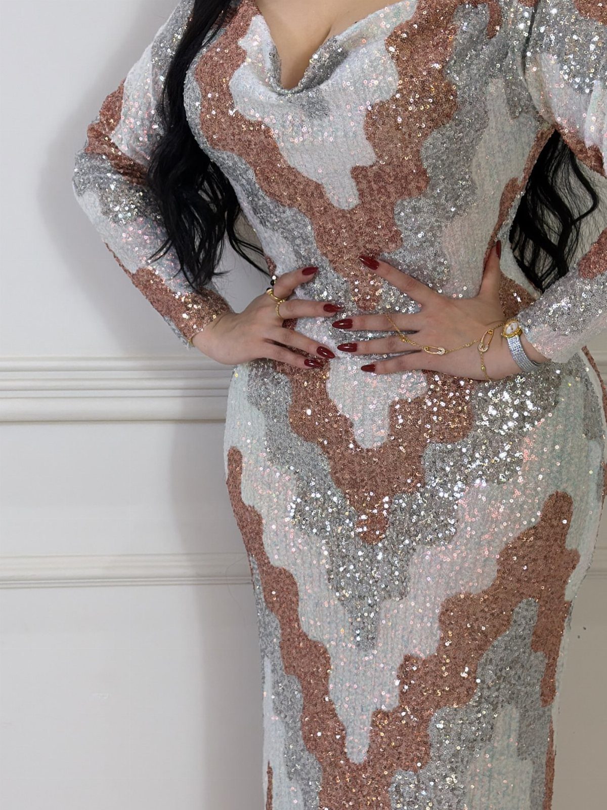10 Zara Party Dresses to Wear This Season 8 Sequined maxi dress with silver and gold zig-zag patterns worn by a woman.